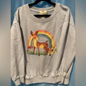 Light blue girls sweatshirt with Bambi / baby deer rainbow graphic. Size XL.